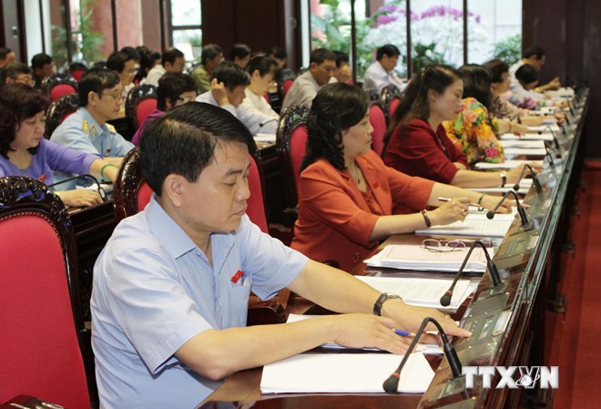 Đại biểu Quốc hội biểu quyết thông qua Luật phá sản (sửa đổi).